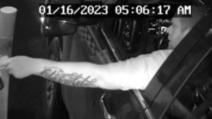 security footage of tattooed man