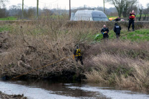 A police diving team works at the River Wyre as they continue their search for missing woman Nicola Bulley