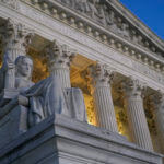 Light illuminates part of the Supreme Court