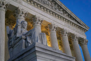 Light illuminates part of the Supreme Court