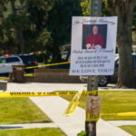 An image of Bishop David O'Connell is posted on the post of a street sign near his home