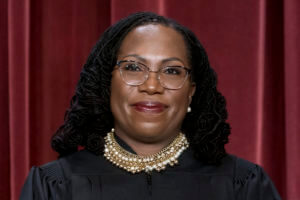 Justice Ketanji Brown Jackson poses for the Supreme Court group portrait.