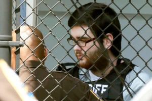 White supremacist James Alex Fields Jr. is led out of court. 