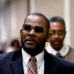 R. Kelly, center, leaves the Daley Center after a hearing in his child support case May 8, 2019