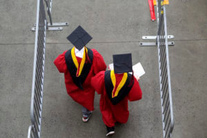 New graduates walk into the High Point Solutions Stadium before the start of the Rutgers University graduation ceremony