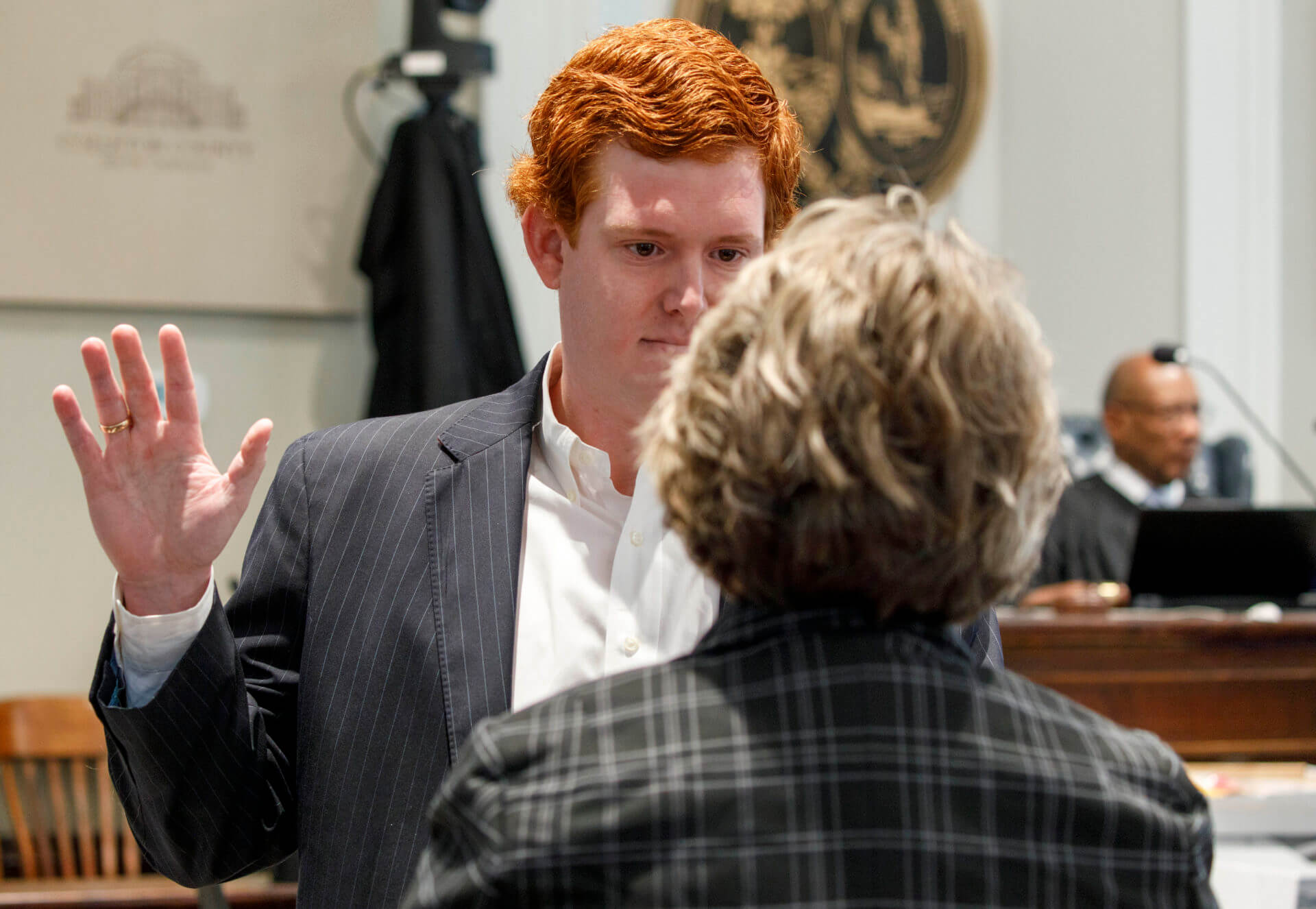 Buster Murdaugh, right, the son of Alex Murdaugh, listens to a