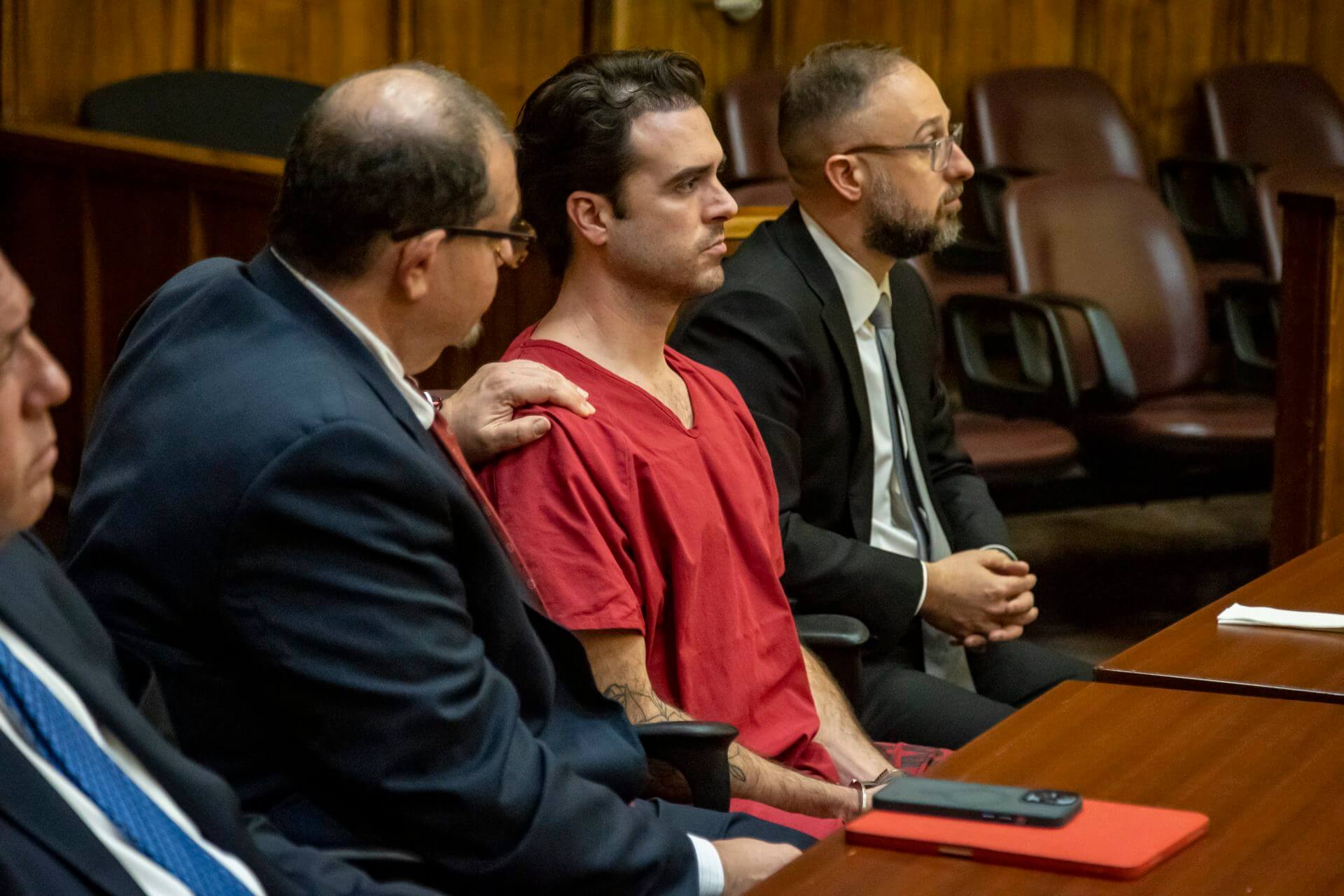 Attorney Phillip Reizenstein places his hand on the shoulder of telenovela star Pablo Lyle as the sentence is read