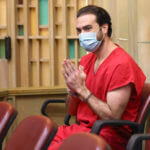 Pablo Lyle gestures toward family members as they appear in court