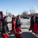 People participate in a march in downtown Rapid City, S.D., Thursday, Feb. 14, 2019