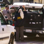 Authorities talk near the home of Bishop David O'Connell