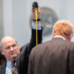 Defense attorney Jim Griffin measures Alex Murdaugh during a break in his double murder trial