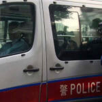 a police van believed to be carrying relatives of murdered model Abby Choi