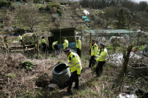 Police officers work in an urgent search operation to find the missing baby of Constance Marten