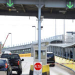 Motorists pay a bridge toll at Gateway International Bridge