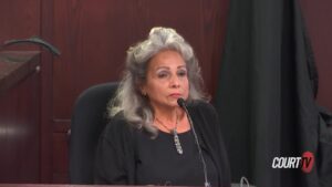 Norma Towers sits on the witness stand