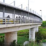 Pedestrians cross Gateway International Bridge