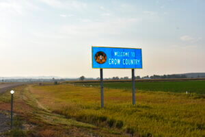 a sign marking the boundary of the Crow Indian Reservation stands near Hardin