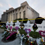 Wooden Jewish stars sit outside the Tree of Life synagogue as a memorial