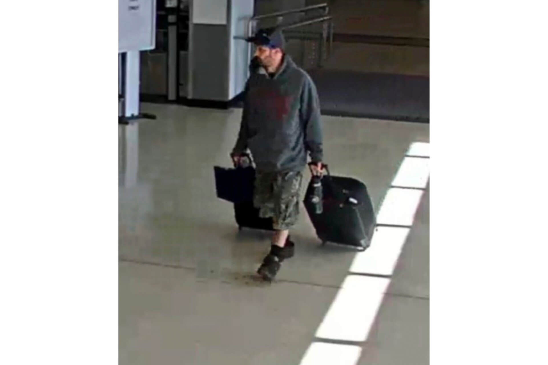 Airport surveillance camera shows alleged suspect Marc Muffley.