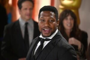 Jonathan Majors arrives at the Oscars
