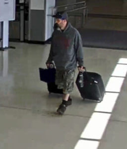 Airport surveillance camera shows alleged suspect Marc Muffley.