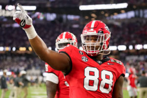 Jalen Carter (88) waves to the crowd before the national championship NCAA College Football Playoff game between Georgia and TCU