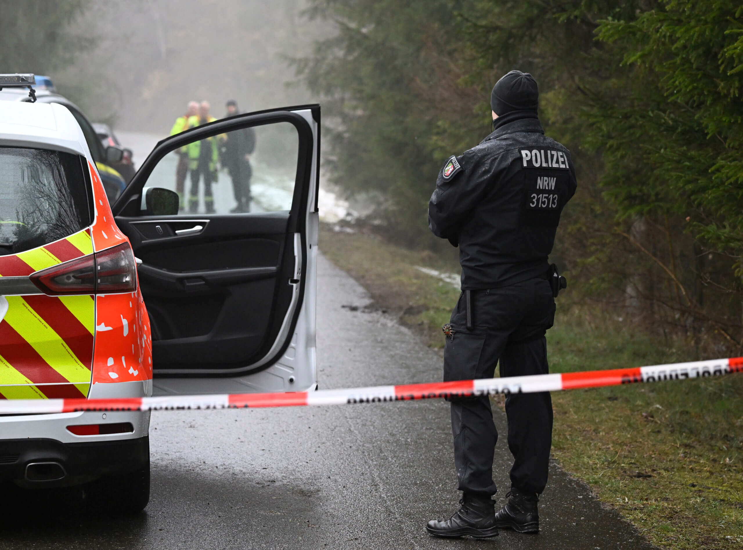 Police forces stand at a cordon near in Freudenberg