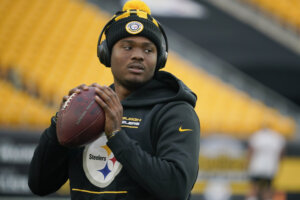 Dwayne Haskins holding a football