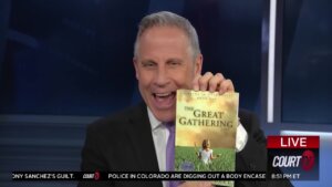 Vinnie Politan holds up a copy of Chad Daybell's book, The Great Gathering.