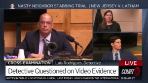 Detective Luis Rodrigues testifies as he is questioned by Christine Long, Zachary Latham at counsel table
