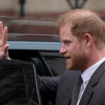 Prince Harry waves.