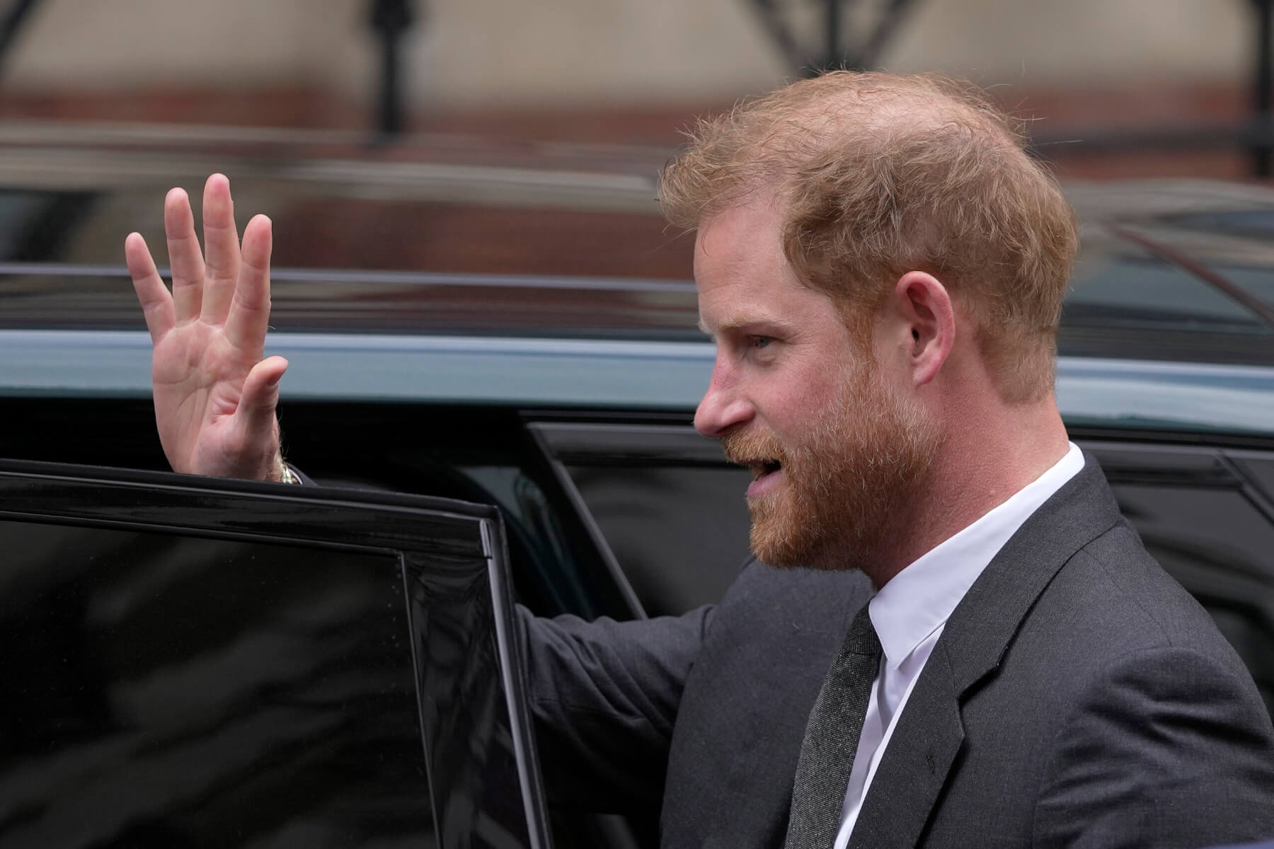 Prince Harry waves.