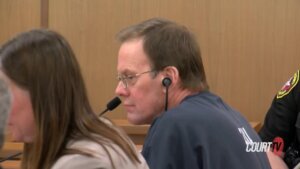 Mark Jensen reacts as the judge sentences him