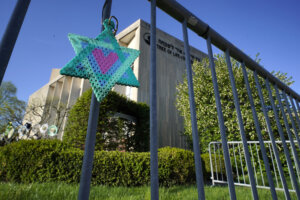 A Star of David hangs from a fence outside the dormant landmark Tree of Life synagogue