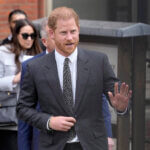 Prince Harry waves.