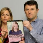 Kate and Gerry McCann pose for the media with a missing poster depicting an age progression computer generated image of their still missing daughter Madeleine