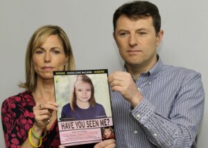 Kate and Gerry McCann pose for the media with a missing poster depicting an age progression computer generated image of their still missing daughter Madeleine