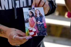 Ashleigh Webster shows a photo of Ivy Webster and Tiffany Guess