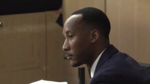 Travis Rudolph sits in court on the second day of his murder trial