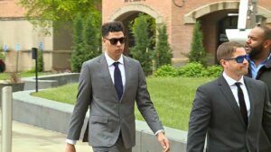 Jackson Mahomes walks outside of the courthouse