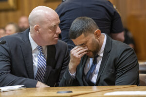 Nauman Hussain, right, sitting with his attorney Lee Kindlon, reacts as the verdict is read