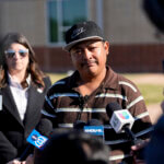 Mass shooting survivor Wilson Garcia talks to the media