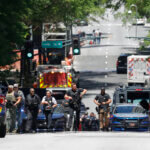 Emergency vehicles and police on a street