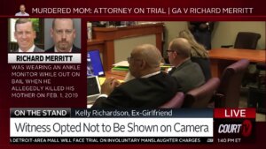 Richard Merritt and his attorneys sit at the counsel table in court