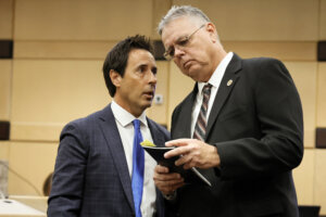 Former Marjory Stoneman Douglas High School School Resource Officer Scot Peterson, right, speaks with his defense lawyer Mark Eiglarsh in court.