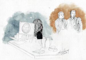 Sketch showing Lori Vallow Daybell looking on as her lawyers talk.