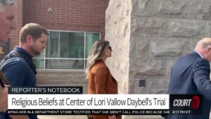 Melani Pawlowski walks past the camera into the courthouse