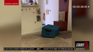 Cell phone video shows a zippered suitcase on a carpet