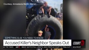 Three young boys with a giant tire