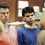 Lyle Menendez, right, and brother Erik listen to a charge of murder conspiracy against them